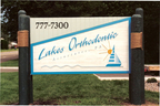 Lakes Orthodontic - 4' x 7' sandblasted cedar, hand painted office monument sign